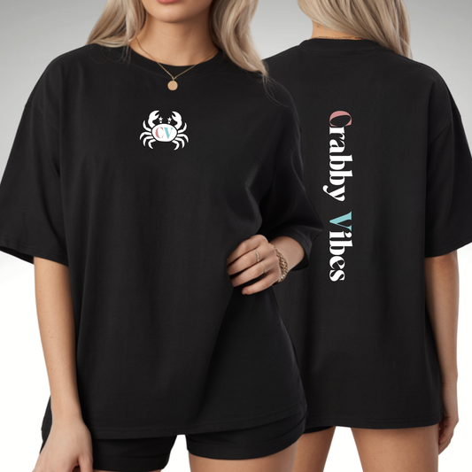 Black comfort colors t-shirt with a crab graphic on the front and 'Crabby Vibes' text on the back.