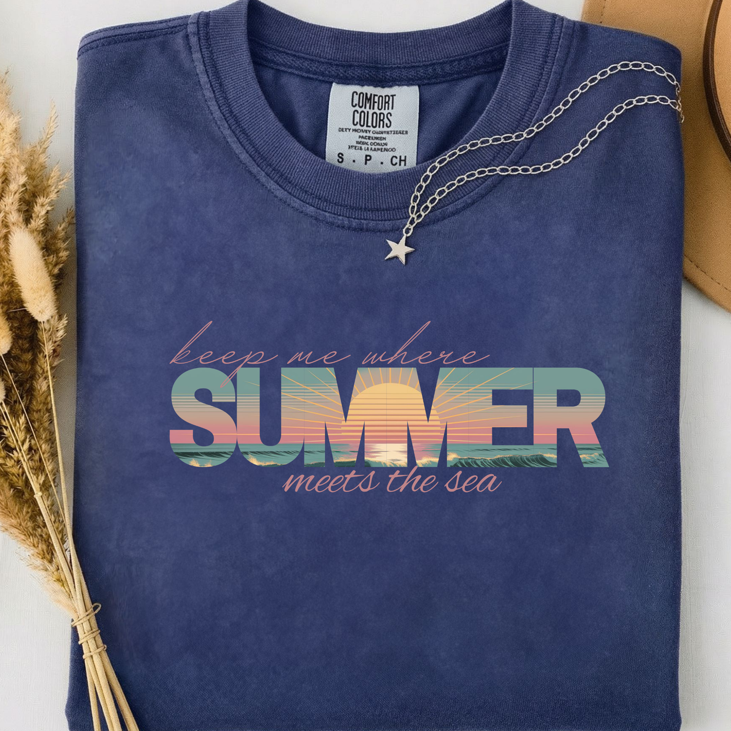 Blue comfort colors t-shirt with 'keep me where Summer meets the sea' text.