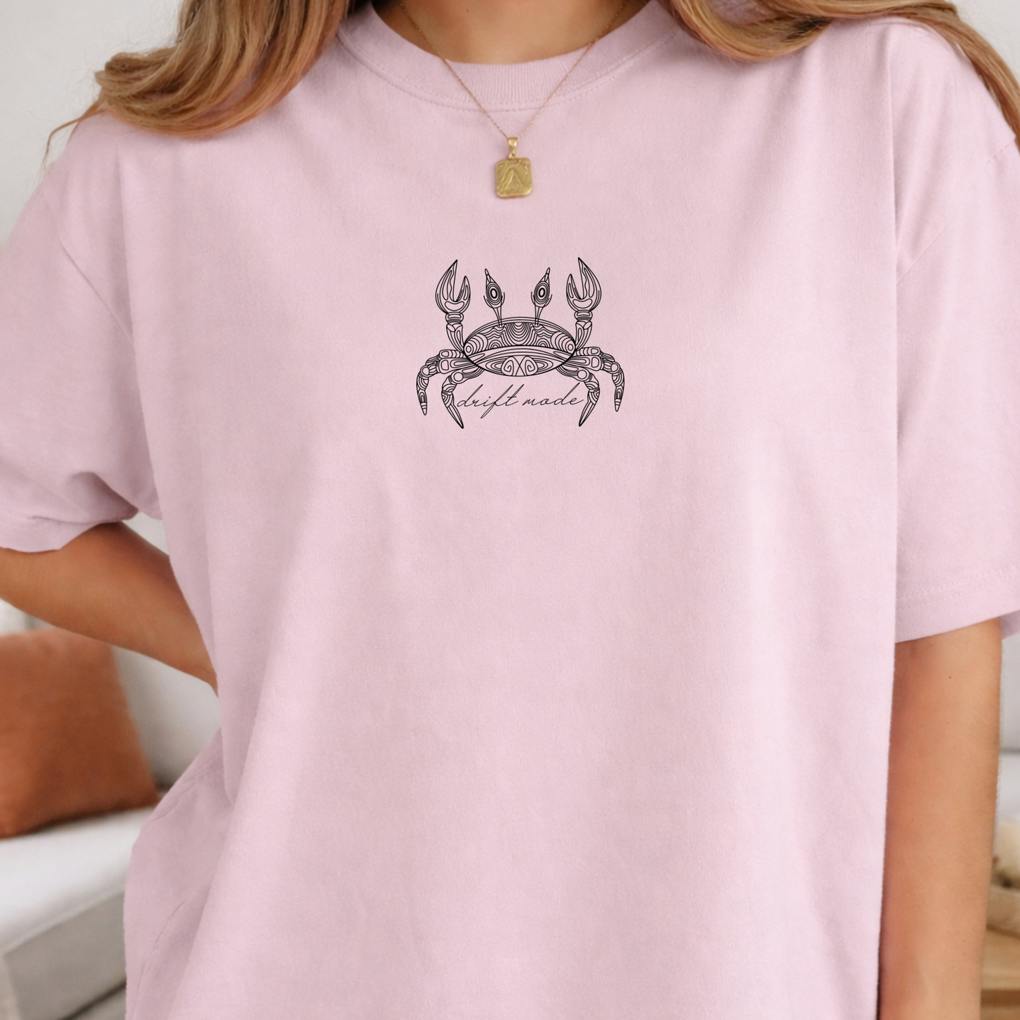 light pink comfort colors t-shirt with a crab line art design alone with a minimalist 'drift mode' text. 