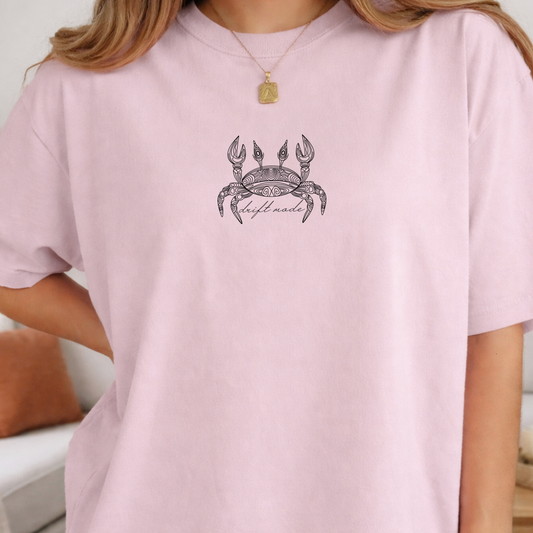 light pink comfort colors t-shirt with a crab line art design alone with a minimalist 'drift mode' text. 
