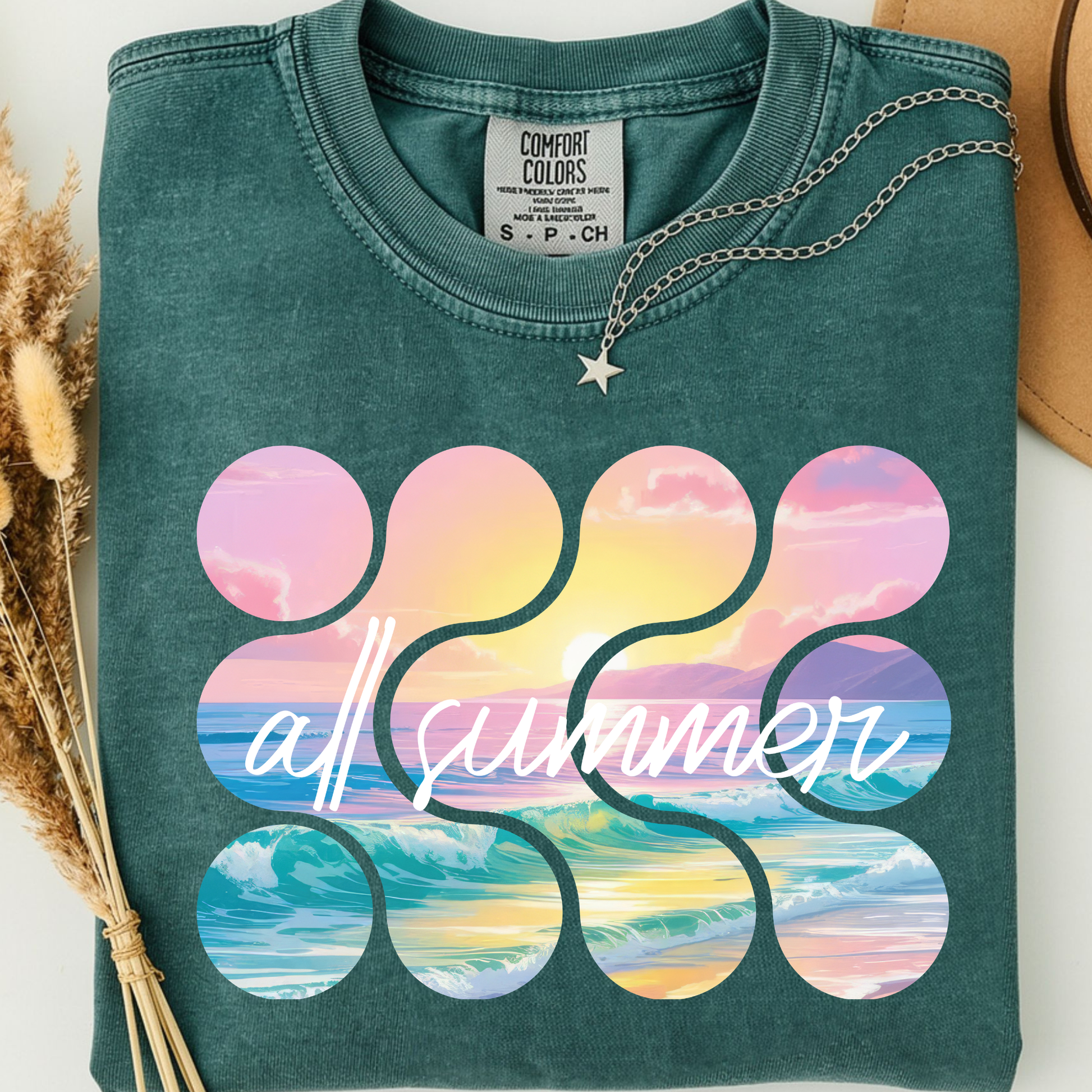 green blue spruce comfort colors t-shirt with colorful beach and sunset design along with 'all summer' text. 
