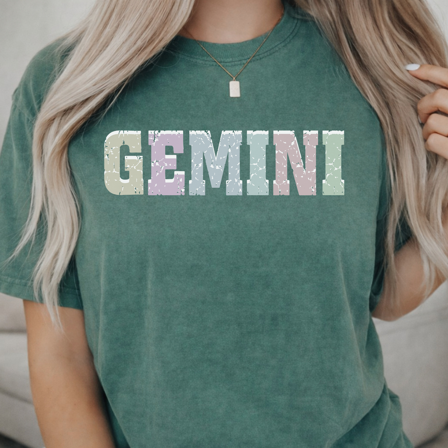green blue spruce comfort colors t-shirt with 'GEMINI' printed in pastel colors. 