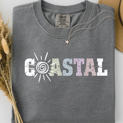 Grey comfort colors t-shirt with 'Coastal' sunny text design.