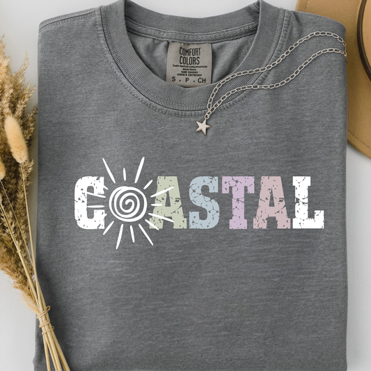 Grey comfort colors t-shirt with 'Coastal' sunny text design.