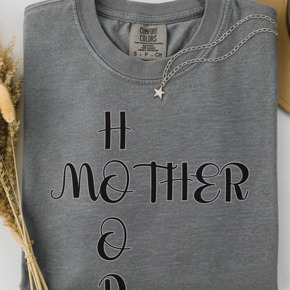 grey comfort colors t-shirt with  'MOTHERHOOD' text. 