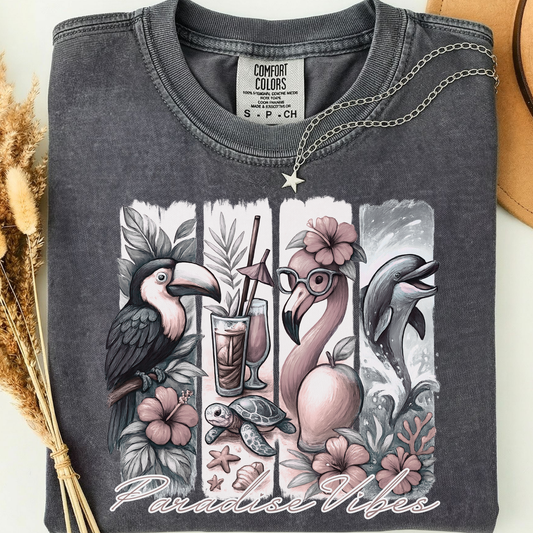 pepper comfort colors t-shirt with a flamingo, dauphin, parrot and tropical design along with the text 'Paradise Vibes'. 