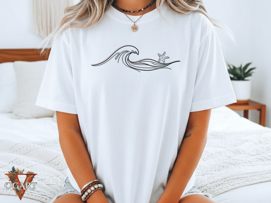 white comfort colors t-shirt with wave and starfish design. 