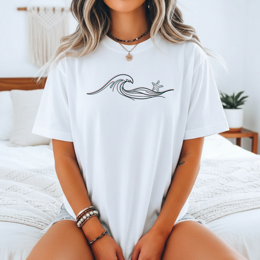 white comfort colors t-shirt with wave and starfish design. 